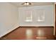 Spacious bedroom showcasing laminate floors, light-filled windows, and neutral walls at 16029 N 36Th Dr, Phoenix, AZ 85053