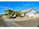 Charming home featuring desert landscaping and mature palm trees on a corner lot at 16029 N 36Th Dr, Phoenix, AZ 85053