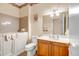 Bathroom featuring a walk-in bathtub, single sink vanity, and toilet at 16051 W Desert Winds Dr, Surprise, AZ 85374