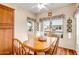 Bright breakfast nook with a view of the neighborhood from the lovely windows at 16051 W Desert Winds Dr, Surprise, AZ 85374