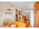 Cozy dining area leading to an open kitchen and living space with backyard views at 16051 W Desert Winds Dr, Surprise, AZ 85374