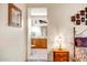 Hallway view leading to the bathroom, with a bedroom visible in the background at 16051 W Desert Winds Dr, Surprise, AZ 85374