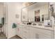 Elegant bathroom with double vanity, quartz countertop, and modern fixtures at 16593 W Alameda Rd, Surprise, AZ 85387