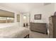 Serene bedroom with a view to the ensuite, natural light, and neutral color palette at 16593 W Alameda Rd, Surprise, AZ 85387