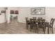 Comfortable dining area with a modern table set and elegant wall decor at 16593 W Alameda Rd, Surprise, AZ 85387