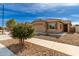 Well-kept single-story house featuring a tile roof, desert landscaping and a two car garage at 16593 W Alameda Rd, Surprise, AZ 85387