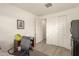 Home office with two windows, closet, and neutral decor creating a calm workspace at 16593 W Alameda Rd, Surprise, AZ 85387