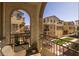 Comfortable balcony with seating and views of the lush community at 1677 E Bridgeport Pkwy, Gilbert, AZ 85295