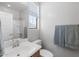 Well-lit bathroom featuring modern fixtures, light wood cabinets, and a shower-tub combination at 1677 E Bridgeport Pkwy, Gilbert, AZ 85295