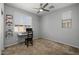 Well-lit bedroom with ample natural light, offering a comfortable workspace and a ceiling fan at 1677 E Bridgeport Pkwy, Gilbert, AZ 85295