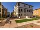 This is a beautiful townhome with lush green grass and an inviting walkway at 1677 E Bridgeport Pkwy, Gilbert, AZ 85295