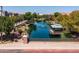 Beautiful community pond with fountain and gazebo surrounded by lush greenery at 1677 E Bridgeport Pkwy, Gilbert, AZ 85295