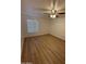 Bright bedroom featuring hardwood floors, a ceiling fan, and natural light at 17017 N 12Th St # 1135, Phoenix, AZ 85022