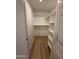 Spacious walk-in closet with ample storage including shelves and hanging racks at 17017 N 12Th St # 1135, Phoenix, AZ 85022