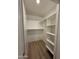 Walk-in closet offering ample storage with shelving and rod space at 17017 N 12Th St # 1135, Phoenix, AZ 85022