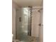 Modern shower featuring glass doors, decorative tile, and updated fixtures at 17017 N 12Th St # 1135, Phoenix, AZ 85022