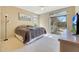 Bright bedroom with a sliding glass door leading to the backyard, and a light-colored carpet at 17036 N 43Rd Pl, Phoenix, AZ 85032