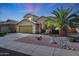 Charming two-story home with manicured desert landscaping, an attached garage, and great curb appeal at 17036 N 43Rd Pl, Phoenix, AZ 85032