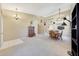 Open-concept living room with high ceilings, neutral colors, and large windows allowing natural light at 17036 N 43Rd Pl, Phoenix, AZ 85032