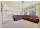 Cozy living room with open floor plan featuring large windows, vaulted ceiling, and comfortable furniture at 17036 N 43Rd Pl, Phoenix, AZ 85032