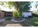 Relaxing backyard with covered patio, mature trees, and beautiful landscaping at 19013 N 18Th Ave, Phoenix, AZ 85027