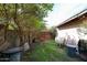 A lovely backyard featuring mature greenery and a wooden gate at 19013 N 18Th Ave, Phoenix, AZ 85027