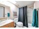 A functional bathroom with a shower-tub combo and single sink vanity at 19013 N 18Th Ave, Phoenix, AZ 85027