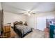 Cozy bedroom with tile flooring, a ceiling fan, and closet with sliding doors at 19013 N 18Th Ave, Phoenix, AZ 85027