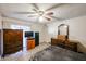 Bedroom with tile flooring, a ceiling fan, and classic wooden furniture at 19013 N 18Th Ave, Phoenix, AZ 85027