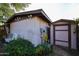 View of the side exterior and storage shed, showcasing yard features and mature landscaping at 19013 N 18Th Ave, Phoenix, AZ 85027