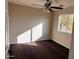 Sunny bedroom with neutral walls and a ceiling fan at 2016 S 66Th Ln, Phoenix, AZ 85043