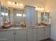 Elegant bathroom featuring double sinks, granite countertops, and ample cabinet space at 2038 W Union Park Dr, Phoenix, AZ 85085