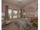 Whimsical bedroom with an oversized window and tennis themed decor at 2038 W Union Park Dr, Phoenix, AZ 85085