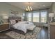 Serene main bedroom with chandelier, natural light, and stylish furnishings at 2038 W Union Park Dr, Phoenix, AZ 85085