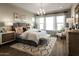 Elegant main bedroom with large windows, soft lighting and a decorative rug at 2038 W Union Park Dr, Phoenix, AZ 85085