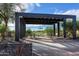 Stylish outdoor lounge area with modern pergola, seating, and desert landscaping, ideal for relaxation and socializing at 2038 W Union Park Dr, Phoenix, AZ 85085