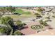 Aerial view of golf course with homes in the background and desert landscaping at 21614 N 138Th Ave, Sun City West, AZ 85375