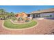 Well maintained backyard of a home with desert landscaping and view of another home at 21614 N 138Th Ave, Sun City West, AZ 85375