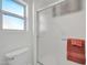 Close-up shot of the shower with sliding glass door and towel bar in a renovated bathroom at 21614 N 138Th Ave, Sun City West, AZ 85375