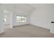 Serene bedroom with neutral tones, plush carpeting, and a large window offering plenty of natural light at 21614 N 138Th Ave, Sun City West, AZ 85375