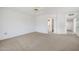 Spacious, light-filled bedroom with neutral tones and carpeted flooring at 21614 N 138Th Ave, Sun City West, AZ 85375