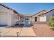 Inviting front entrance featuring a tiled roof, desert landscaping, and a view to the charming front door at 21614 N 138Th Ave, Sun City West, AZ 85375