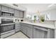 Well-lit kitchen with modern appliances and a view of the backyard at 21614 N 138Th Ave, Sun City West, AZ 85375