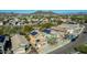 Aerial view of desert homes with solar panels on the roofs in a well-planned community at 2168 E Vista Bonita Dr, Phoenix, AZ 85024