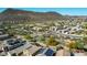 Expansive aerial view of a neighborhood with desert landscaping and mountains in the background at 2168 E Vista Bonita Dr, Phoenix, AZ 85024