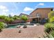 Backyard with a pool, rock landscaping, and covered patio at 2168 E Vista Bonita Dr, Phoenix, AZ 85024