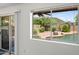 Inviting backyard view through the window, showcasing the pool and desert landscaping at 2168 E Vista Bonita Dr, Phoenix, AZ 85024