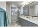 Bathroom featuring double sink vanity and glass enclosed shower at 2168 E Vista Bonita Dr, Phoenix, AZ 85024