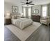 Bright bedroom with a ceiling fan, large windows, a comfy chair, and a neutral color palette at 2168 E Vista Bonita Dr, Phoenix, AZ 85024