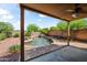 Relaxing covered patio with a view of the sparkling pool and lush landscaping at 2168 E Vista Bonita Dr, Phoenix, AZ 85024